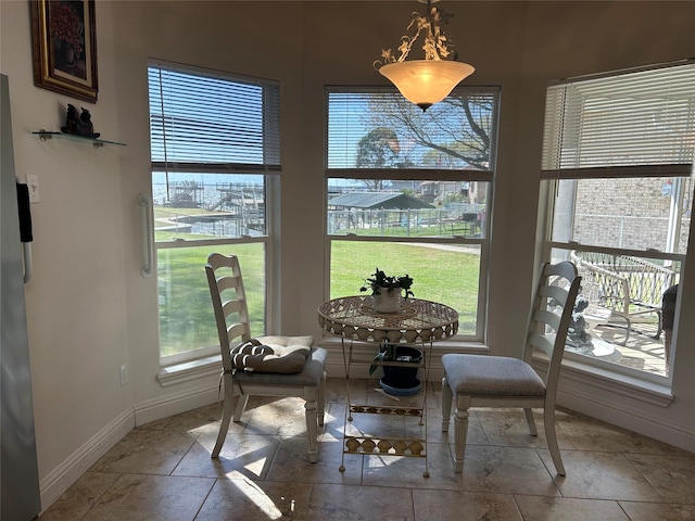 dining space featuring baseboards