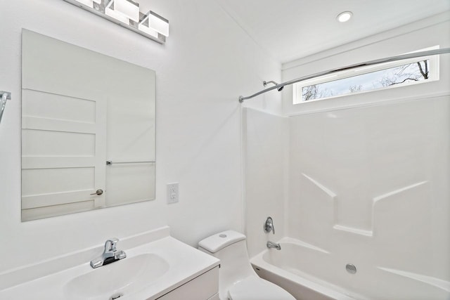 full bath featuring toilet, vanity, and shower / bath combination