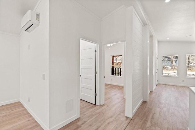 hallway with plenty of natural light, an AC wall unit, and ornamental molding