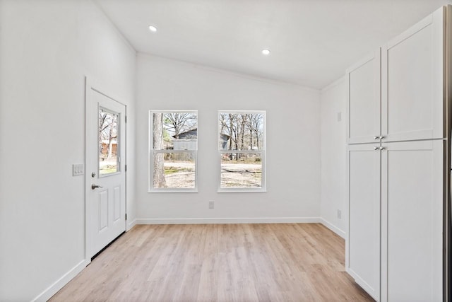 entryway featuring recessed lighting, light wood-style flooring, and baseboards