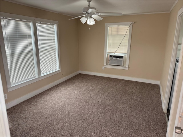 carpeted empty room featuring ornamental molding, cooling unit, baseboards, and ceiling fan