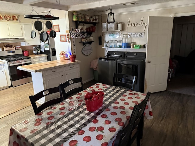 dining room with washer and clothes dryer and light wood-style flooring