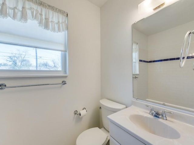 bathroom featuring toilet and vanity