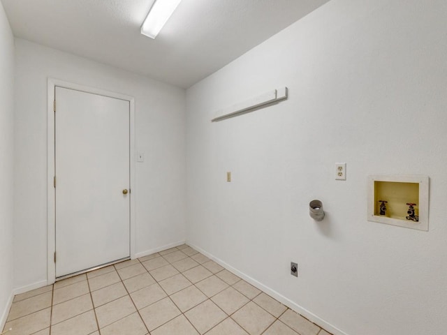 laundry room with baseboards, washer hookup, laundry area, light tile patterned flooring, and electric dryer hookup