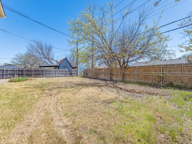 view of yard with a fenced backyard