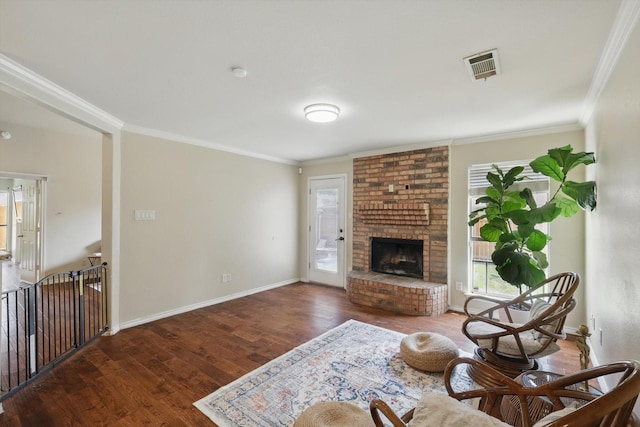 7732 Sagebrush Ct N, North Richland Hills, TX 76182 - living area featuring wood finished floors, plenty of natural light, ornamental molding, a fireplace, and baseboards