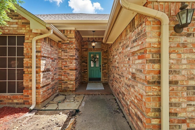 7732 Sagebrush Ct N, North Richland Hills, TX 76182 - view of exterior entry with brick siding and roof with shingles