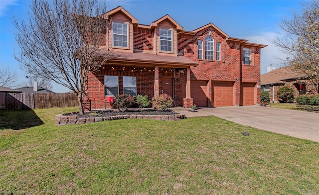 view of front of property featuring driveway, a front yard, fence, brick siding, and a garage