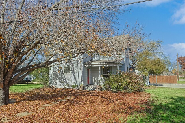 632 E Main, Pilot Point, TX 76258 - obstructed view of property featuring fence and a front yard