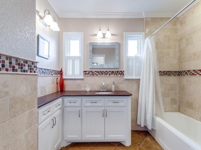 1410 Corto Dr, Dallas, TX 75218 - bathroom with crown molding, tile walls, shower / tub combo with curtain, tile patterned flooring, and vanity