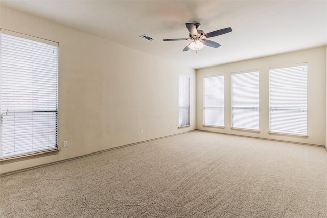1209 Kachina Ln, Fort Worth, TX 76052 - spare room featuring a ceiling fan, light carpet, and baseboards