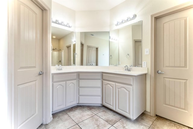 1209 Kachina Ln, Fort Worth, TX 76052 - bathroom featuring double vanity and tile patterned floors