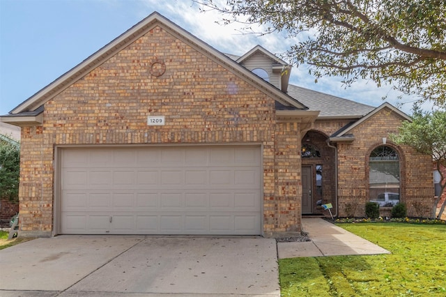1209 Kachina Ln, Fort Worth, TX 76052 - view of front of house featuring brick siding, an attached garage, concrete driveway, a front lawn, and roof with shingles