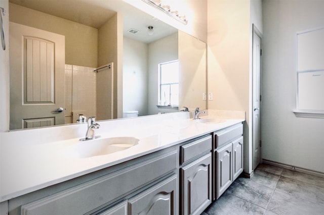 1209 Kachina Ln, Fort Worth, TX 76052 - bathroom with double vanity, toilet, and a shower
