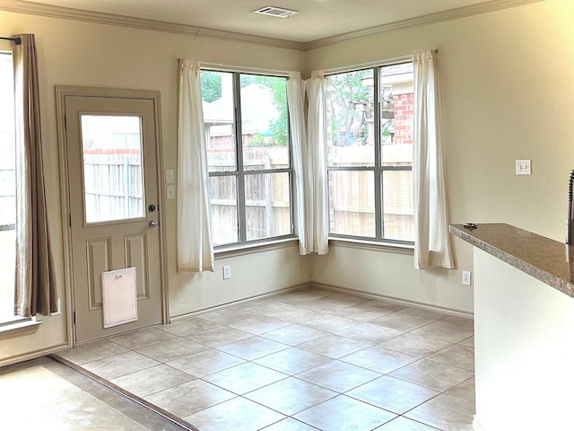 1209 Kachina Ln, Fort Worth, TX 76052 - unfurnished dining area with crown molding and light tile patterned floors