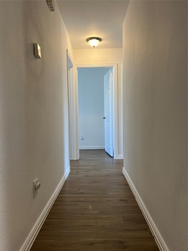 6904 Glenwood Dr, North Richland Hills, TX 76182 - corridor with dark wood-style floors and baseboards