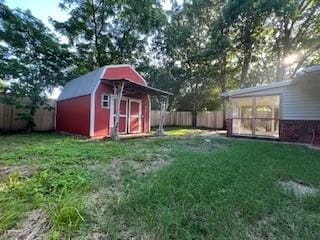 6904 Glenwood Dr, North Richland Hills, TX 76182 - view of yard with a storage unit, a sunroom, and an outbuilding