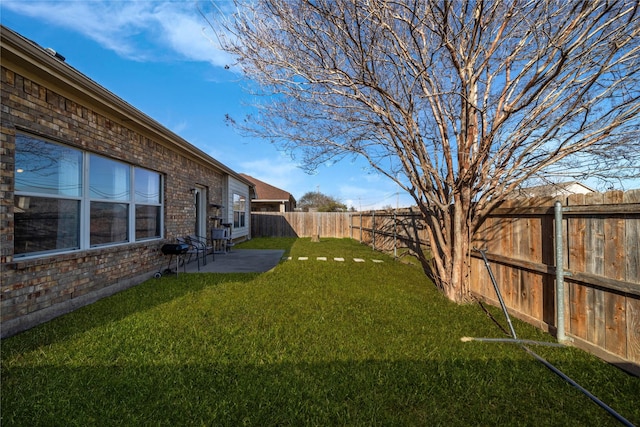 view of yard with a patio and a fenced backyard
