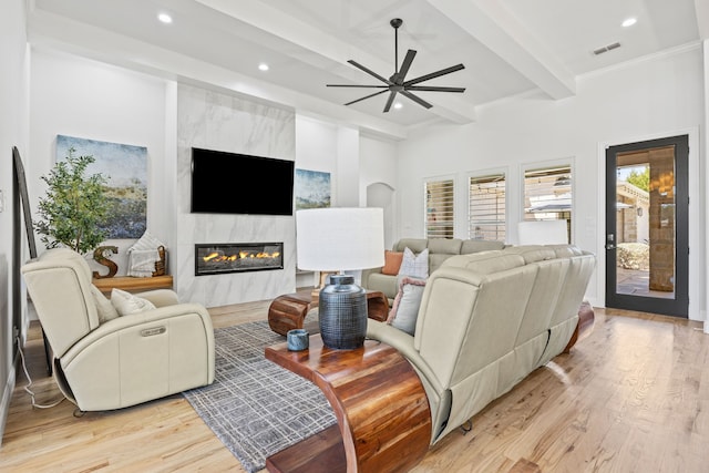 504 Shadow Wood Ln, Heath, TX 75032 - living room with light wood-style floors, recessed lighting, beamed ceiling, a fireplace, and a ceiling fan