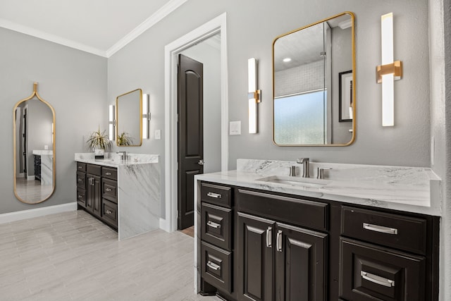 504 Shadow Wood Ln, Heath, TX 75032 - full bath featuring crown molding, two vanities, and baseboards