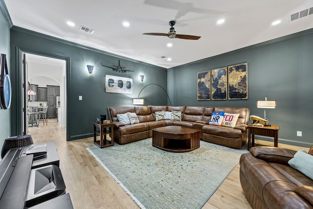 504 Shadow Wood Ln, Heath, TX 75032 - living area featuring ceiling fan, arched walkways, crown molding, light wood finished floors, and baseboards