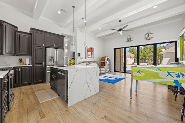 504 Shadow Wood Ln, Heath, TX 75032 - kitchen with appliances with stainless steel finishes, beam ceiling, open floor plan, light wood-style floors, and a ceiling fan