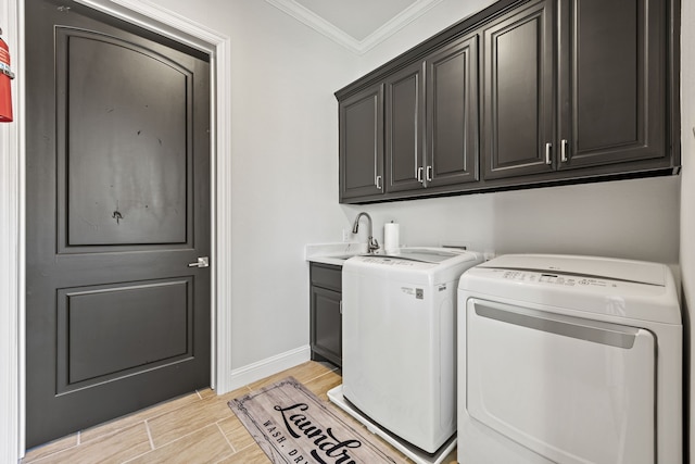 504 Shadow Wood Ln, Heath, TX 75032 - laundry area featuring cabinet space, independent washer and dryer, ornamental molding, baseboards, and wood finish floors