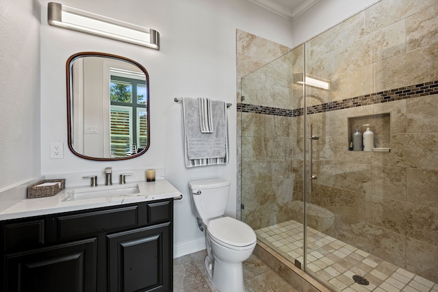 504 Shadow Wood Ln, Heath, TX 75032 - bathroom featuring crown molding, vanity, a stall shower, toilet, and baseboards