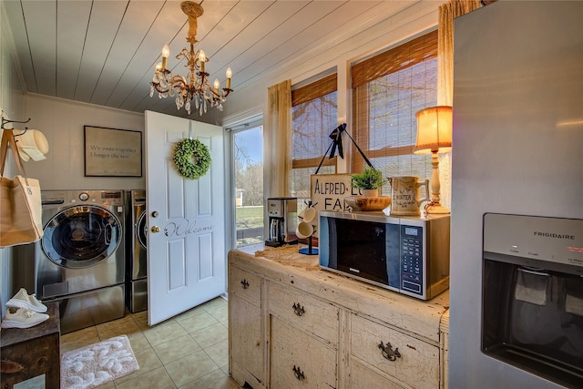 laundry room featuring independent washer and dryer, wooden ceiling, light tile patterned floors, and a chandelier
