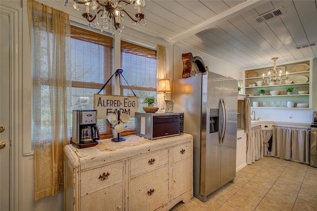 kitchen featuring visible vents, open shelves, a notable chandelier, and appliances with stainless steel finishes