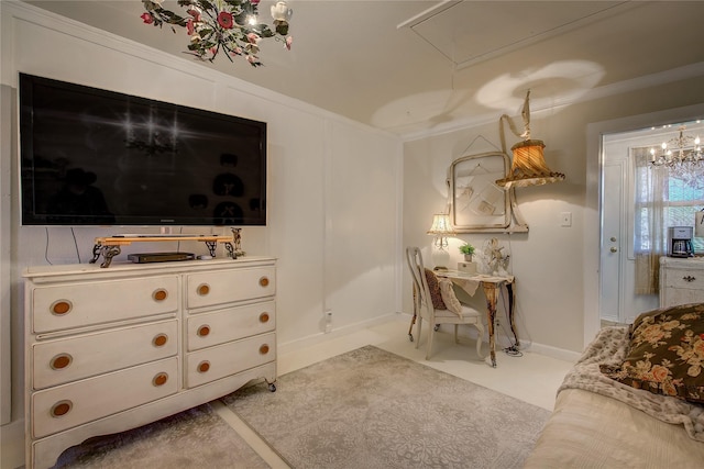 dining space with baseboards, ornamental molding, and attic access
