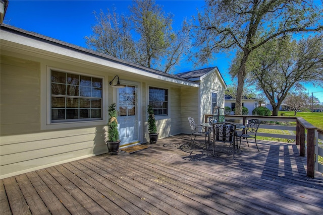 deck featuring outdoor dining area