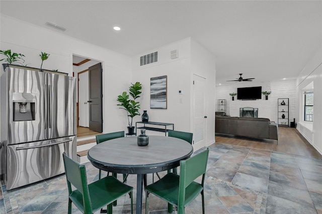 dining area with recessed lighting, visible vents, a fireplace, and a ceiling fan