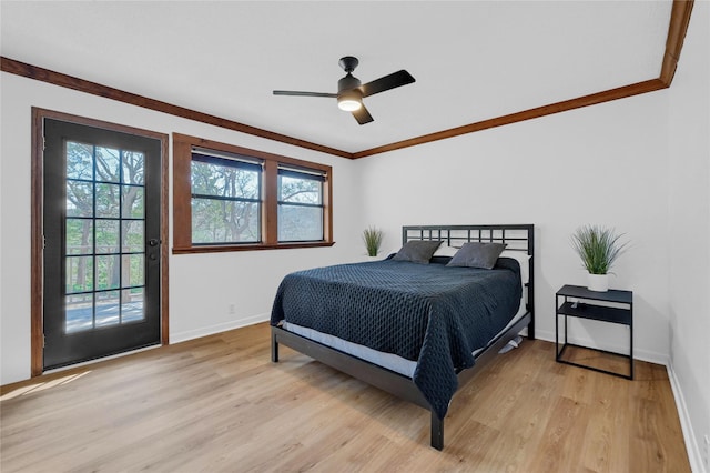 bedroom featuring crown molding, baseboards, light wood-style floors, a ceiling fan, and access to outside