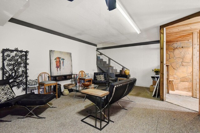 carpeted living area with stairway