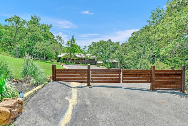 exterior space with a fenced front yard and a yard