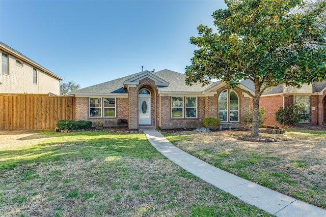 single story home with brick siding and roof with shingles