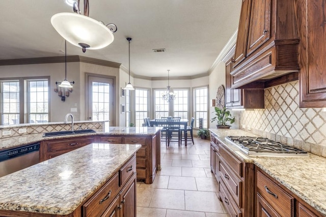 1211 Meredith Creek Ln, Fort Worth, TX 76179 - kitchen with decorative backsplash, visible vents, appliances with stainless steel finishes, light stone counters, and a center island
