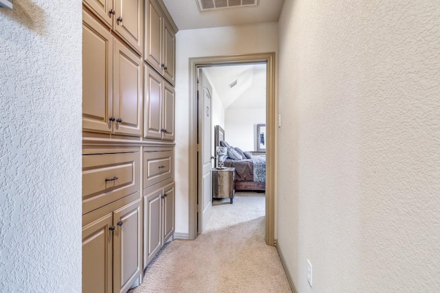 1211 Meredith Creek Ln, Fort Worth, TX 76179 - hallway with a textured wall, baseboards, light colored carpet, and visible vents