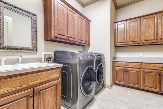 1211 Meredith Creek Ln, Fort Worth, TX 76179 - laundry room featuring light tile patterned flooring, washing machine and dryer, crown molding, a sink, and cabinet space