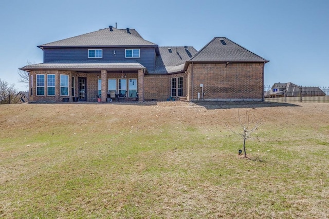 1211 Meredith Creek Ln, Fort Worth, TX 76179 - back of property featuring fence, brick siding, and a yard