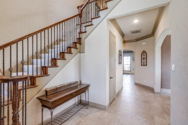 1211 Meredith Creek Ln, Fort Worth, TX 76179 - staircase with arched walkways, crown molding, baseboards, and visible vents