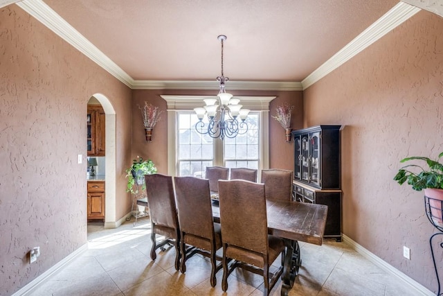 1211 Meredith Creek Ln, Fort Worth, TX 76179 - dining area featuring crown molding, baseboards, arched walkways, a textured wall, and an inviting chandelier