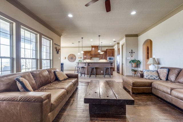 1211 Meredith Creek Ln, Fort Worth, TX 76179 - living area featuring recessed lighting, arched walkways, crown molding, and ceiling fan