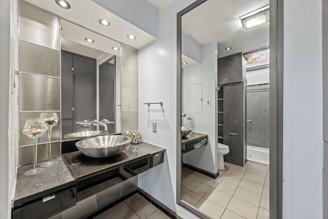 bathroom with a shower stall, toilet, recessed lighting, tile patterned floors, and vanity