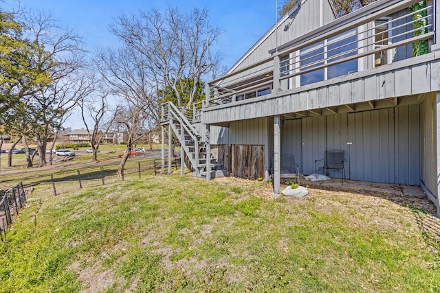 view of yard with stairs, fence, and a wooden deck