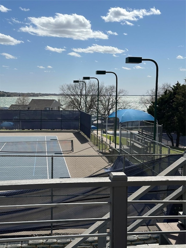 view of sport court with fence