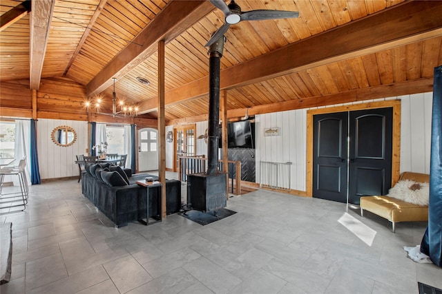 104 Henderson Harbor Cir, Payne Springs, TX 75156 - living room with a wood stove, healthy amount of natural light, wooden ceiling, wooden walls, and a chandelier