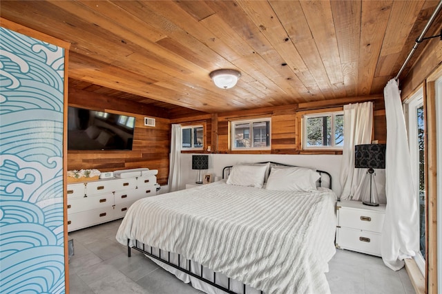104 Henderson Harbor Cir, Payne Springs, TX 75156 - bedroom with wood ceiling, wooden walls, and tile patterned flooring