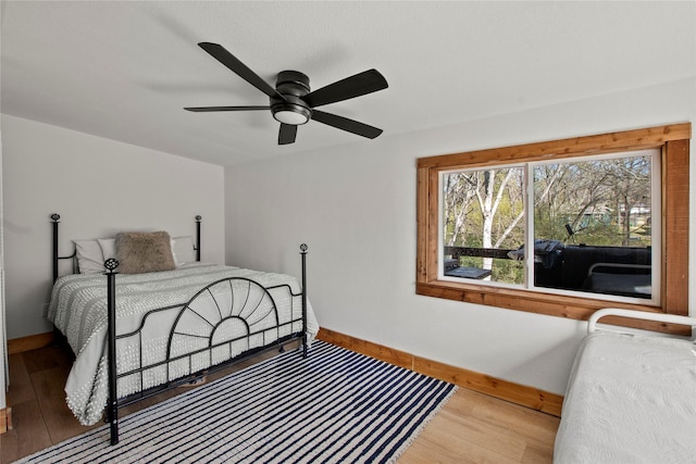 104 Henderson Harbor Cir, Payne Springs, TX 75156 - bedroom featuring baseboards, wood finished floors, and a ceiling fan